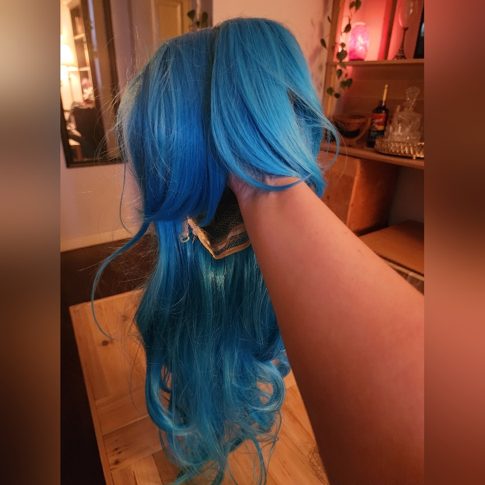 New, never worn long blue wig with curtain bangs